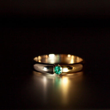 Natural alexandrite gemstone set in 18k white and yellow gold wedding band with shiny polished finish